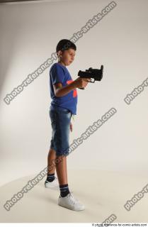 TIMBO STANDING POSE WITH GUN